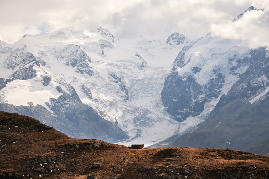 Beautiful Shot House Edge Cliff With Snowy Mountains 1 1024x683